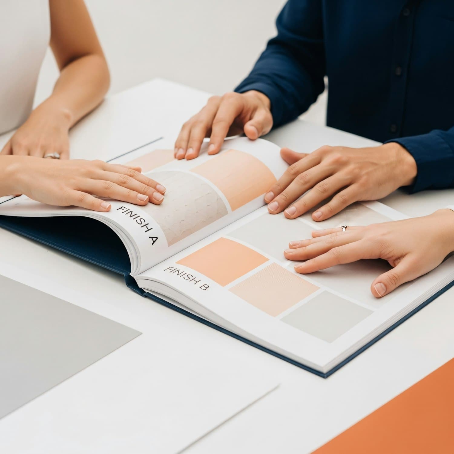Three people reviewing color and texture samples together
